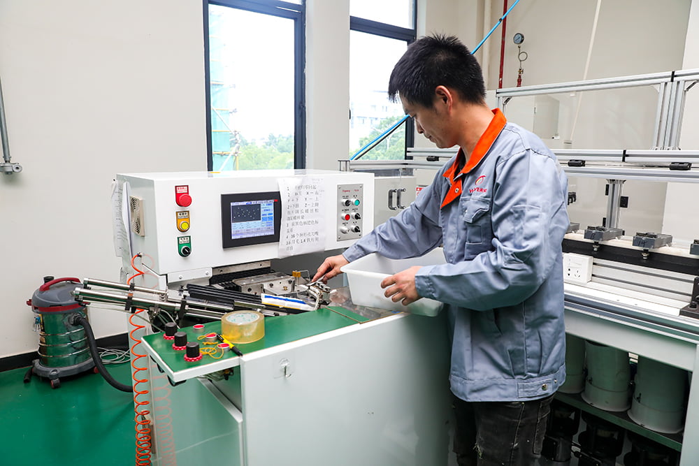 Electric toothbrush tufting machine