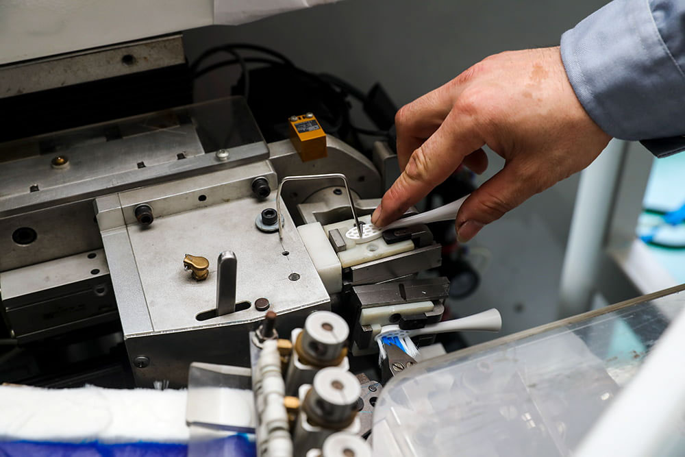 Electric toothbrush tufting machine