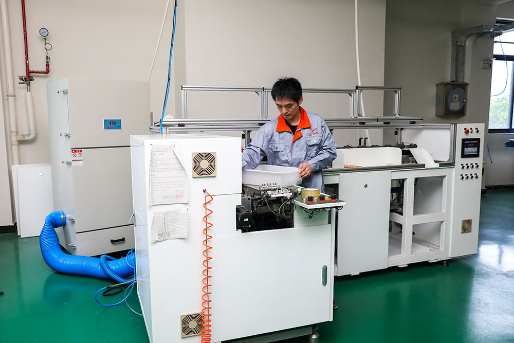 Electric toothbrush tufting machine